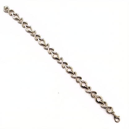 Silver bracelet with a chain design on a white background