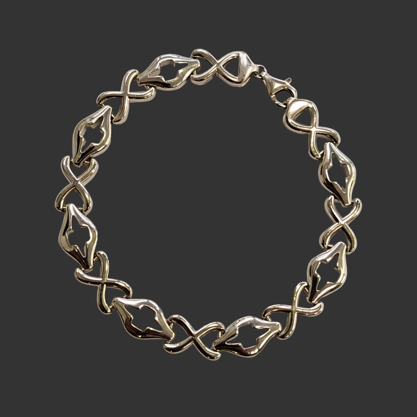 Silver bracelet on a light gray background