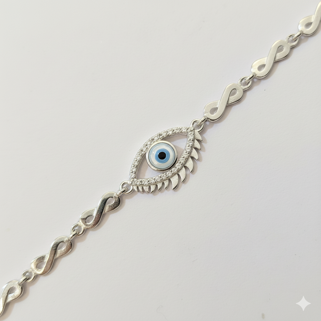 Silver bracelet with eye design on a light gray background