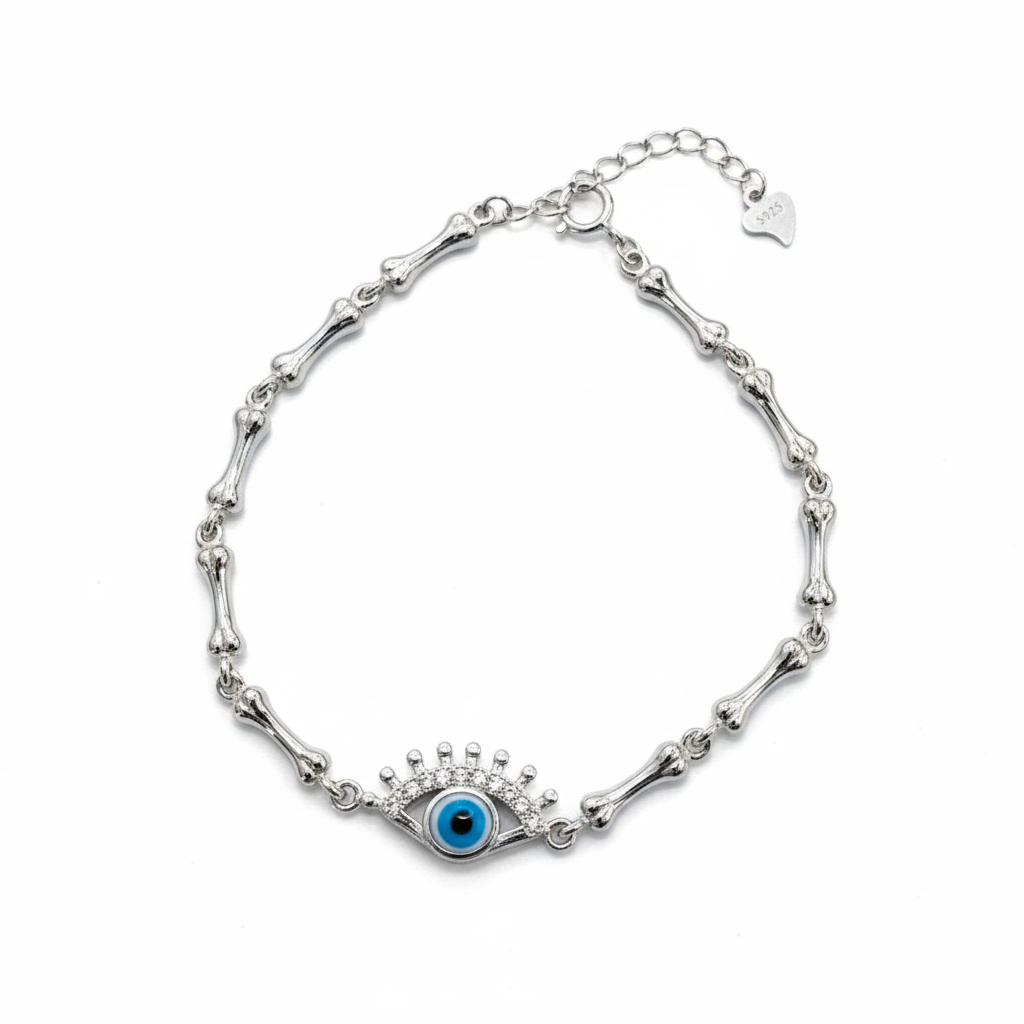 Silver bracelet with a blue eye charm on a white background