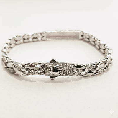 Silver bracelet with a diamond clasp on a white background