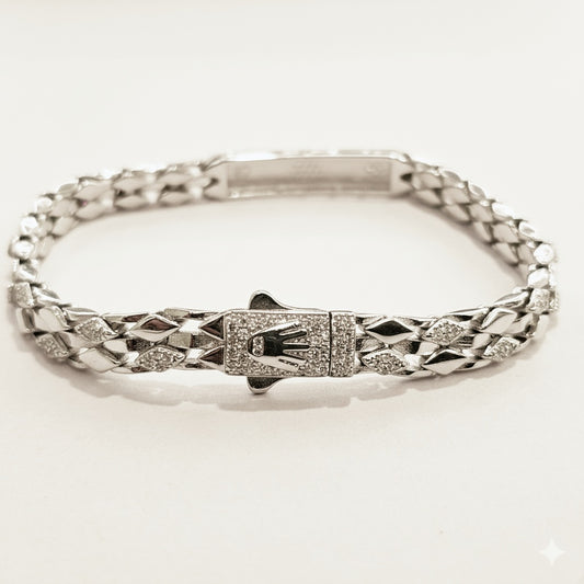 Silver bracelet with a diamond clasp on a white background