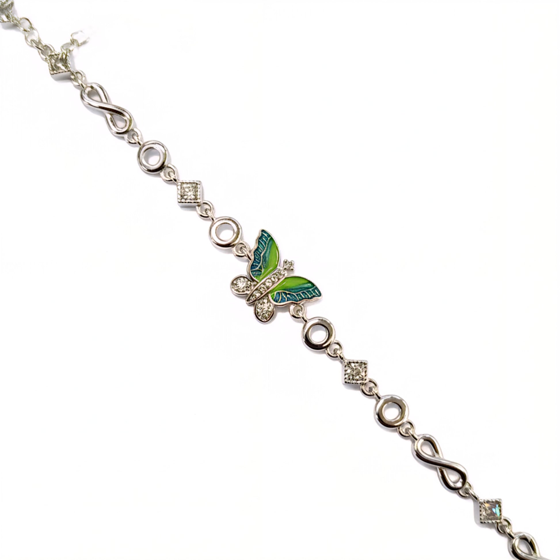 Silver bracelet with a green butterfly charm on a white background